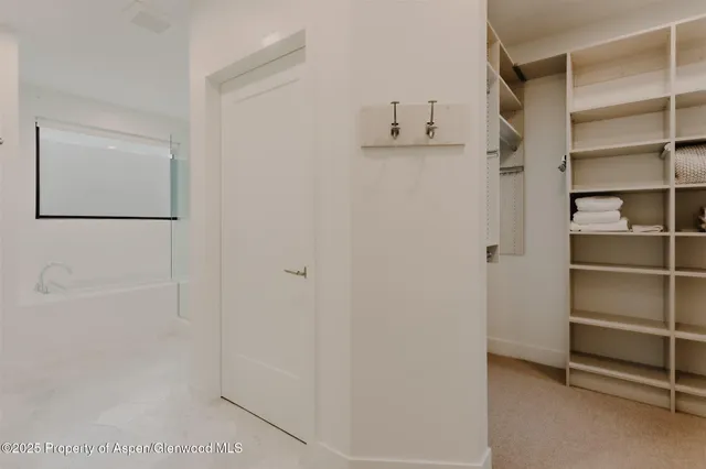 a bedroom with a bed and a night stand