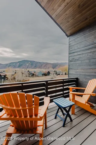 a bathroom with a toilet a sink and a mirror