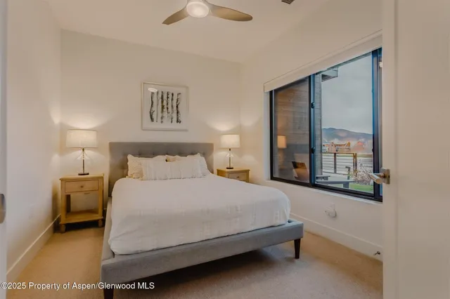 a bedroom with a bed and dresser