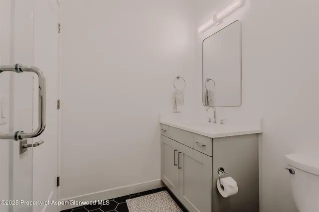 a view of a living room and bathroom