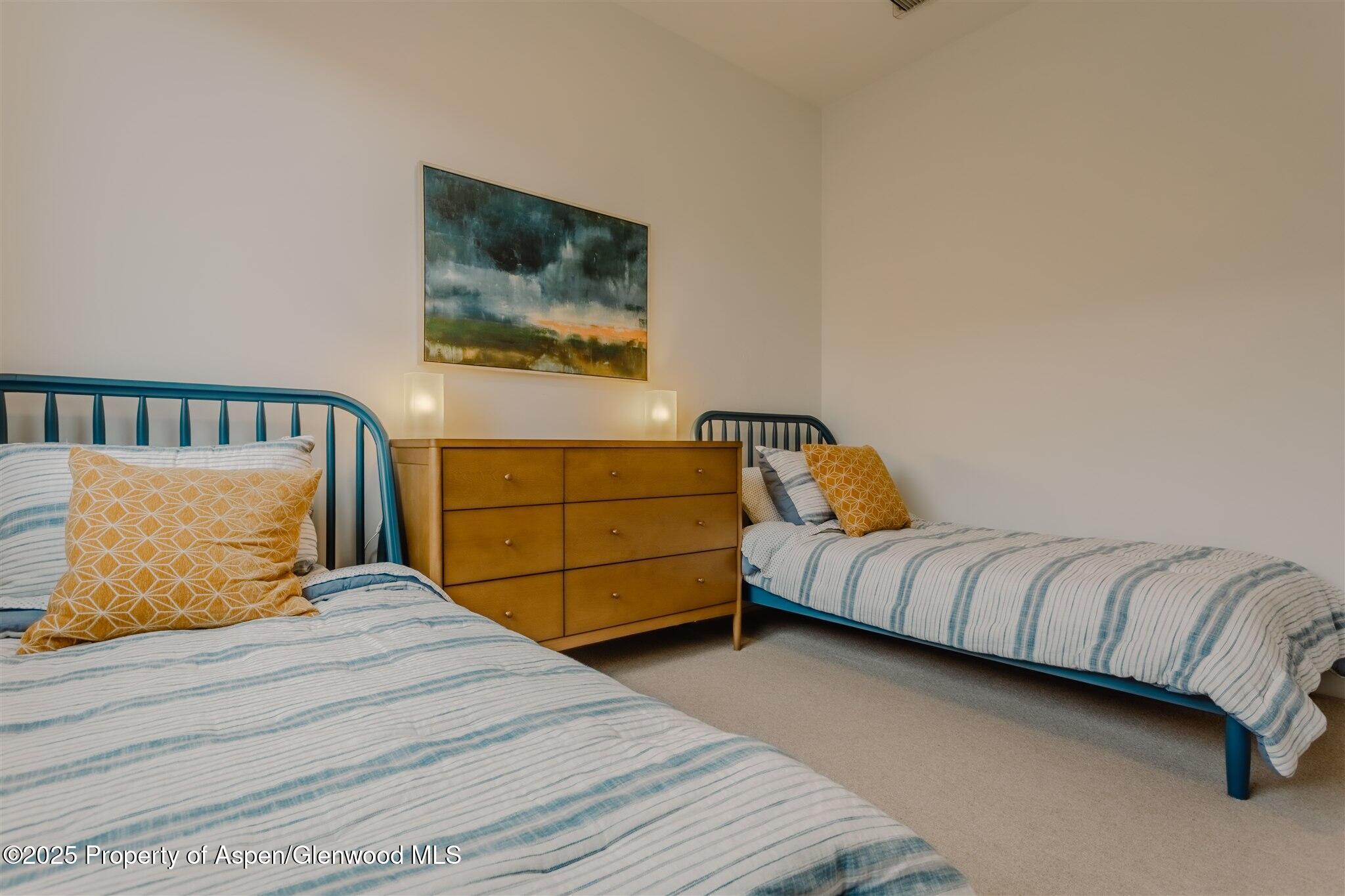 220 Lewis Lane Basalt, CO 81621 - Photo 49 of 62 a bedroom with a bed and dresser