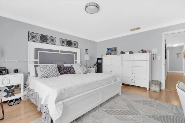 a bedroom with a bed and a cabinets