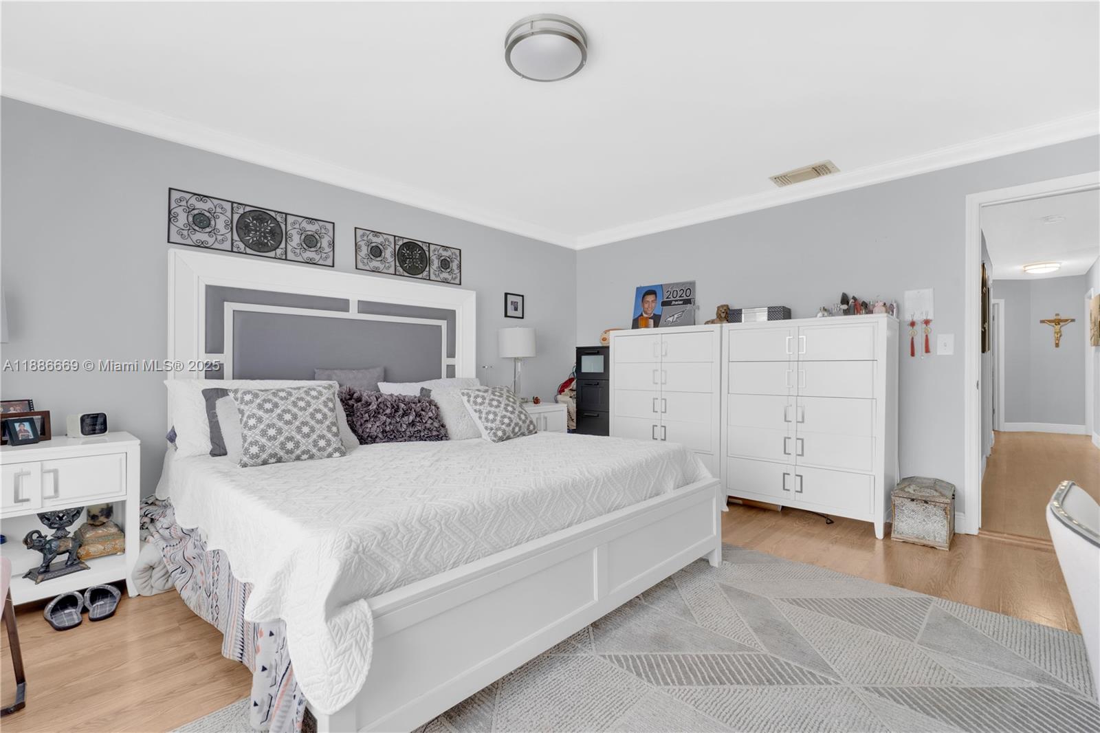 11126 Southwest 148th Place Miami, FL 33196 - Photo 17 of 33 a bedroom with a bed and a cabinets