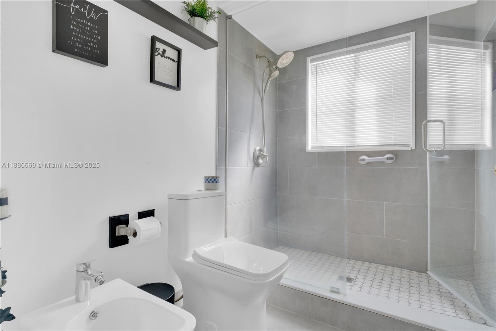 11126 Southwest 148th Place Miami, FL 33196 - Photo 18 of 33 a bathroom with a toilet a sink and shower