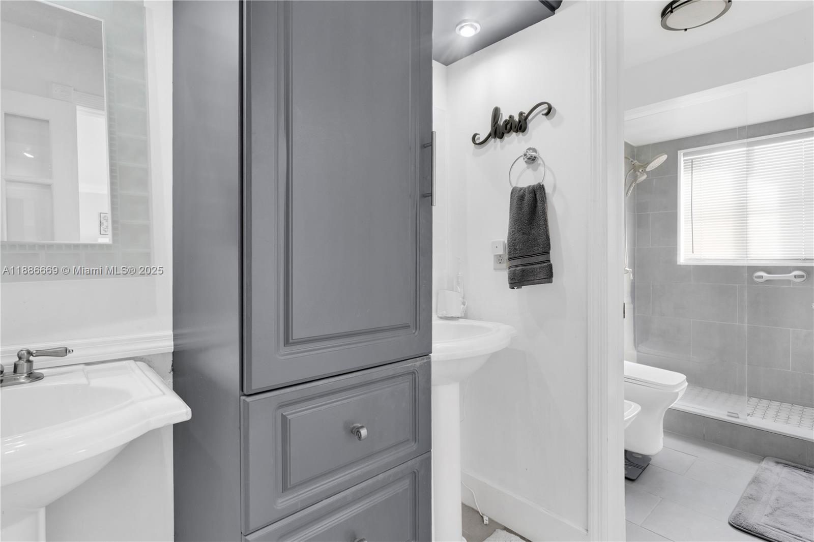 11126 Southwest 148th Place Miami, FL 33196 - Photo 19 of 33 a bathroom with a sink and mirror with toilet