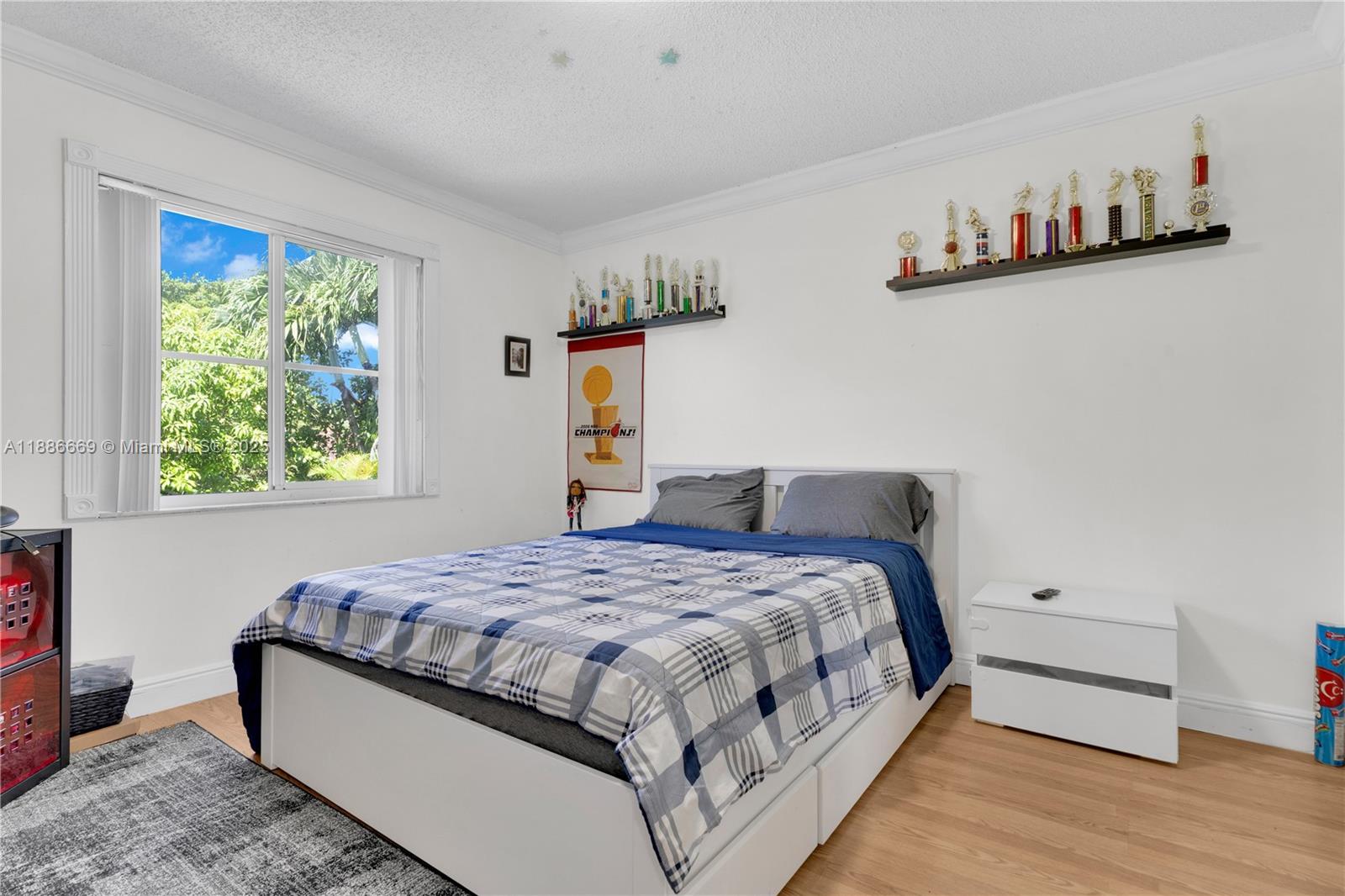 11126 Southwest 148th Place Miami, FL 33196 - Photo 20 of 33 a bedroom with a bed and a window