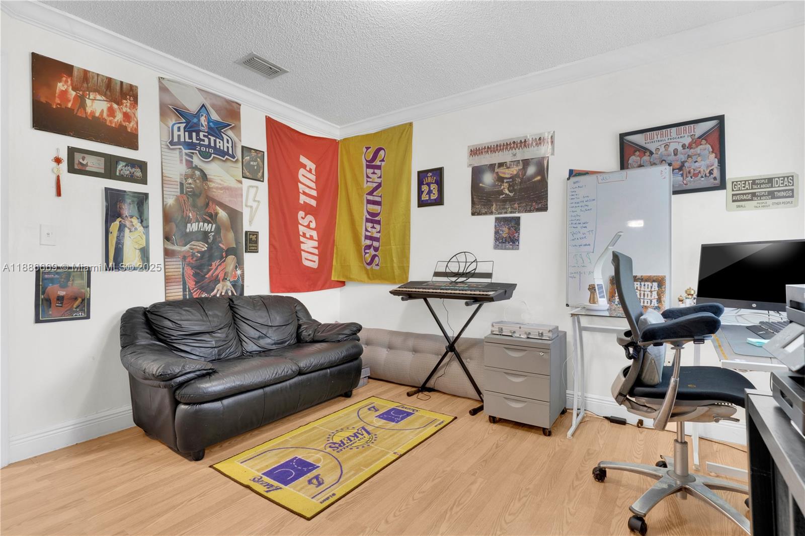 11126 Southwest 148th Place Miami, FL 33196 - Photo 22 of 33 a living room with furniture and a flat screen tv with wooden floor