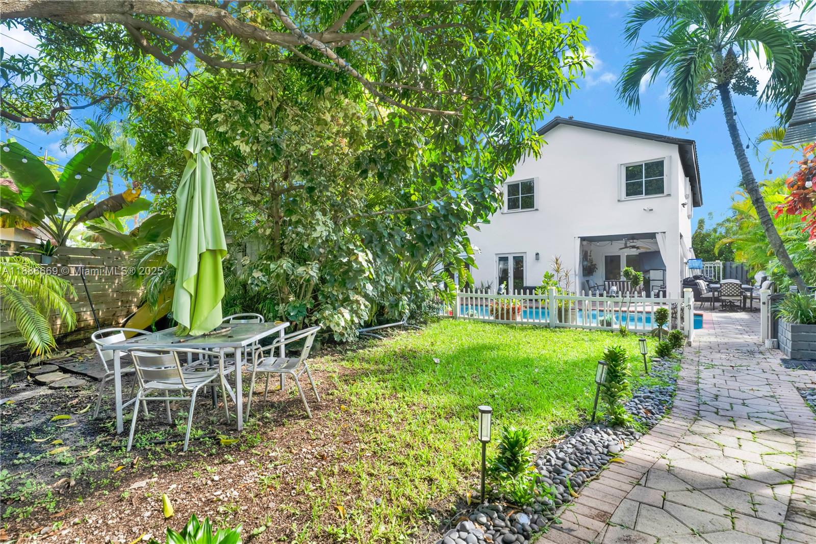 11126 Southwest 148th Place Miami, FL 33196 - Photo 31 of 33 a view of a house with backyard and a sitting area