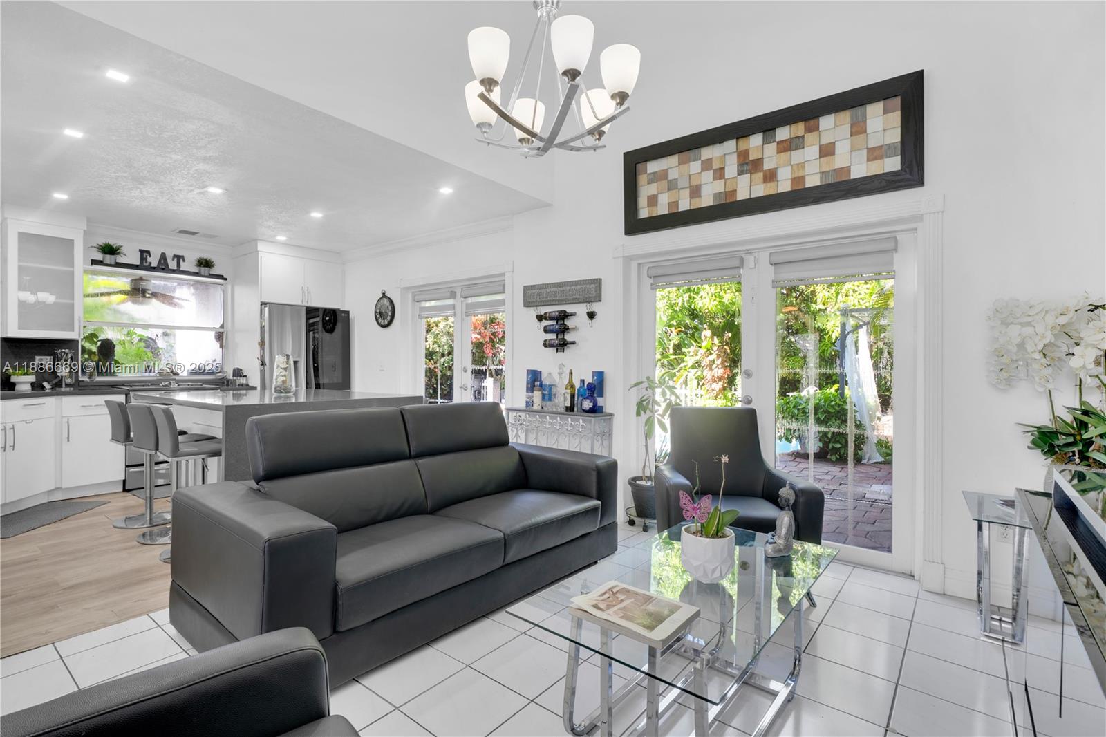 11126 Southwest 148th Place Miami, FL 33196 - Photo 8 of 33 a living room with furniture and a large window