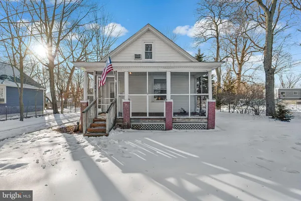 a view of a house with a yard and garage