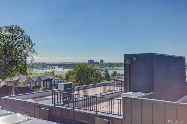 an aerial view of a house with a lake view