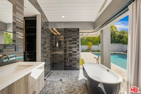 a view of a swimming pool and a yard