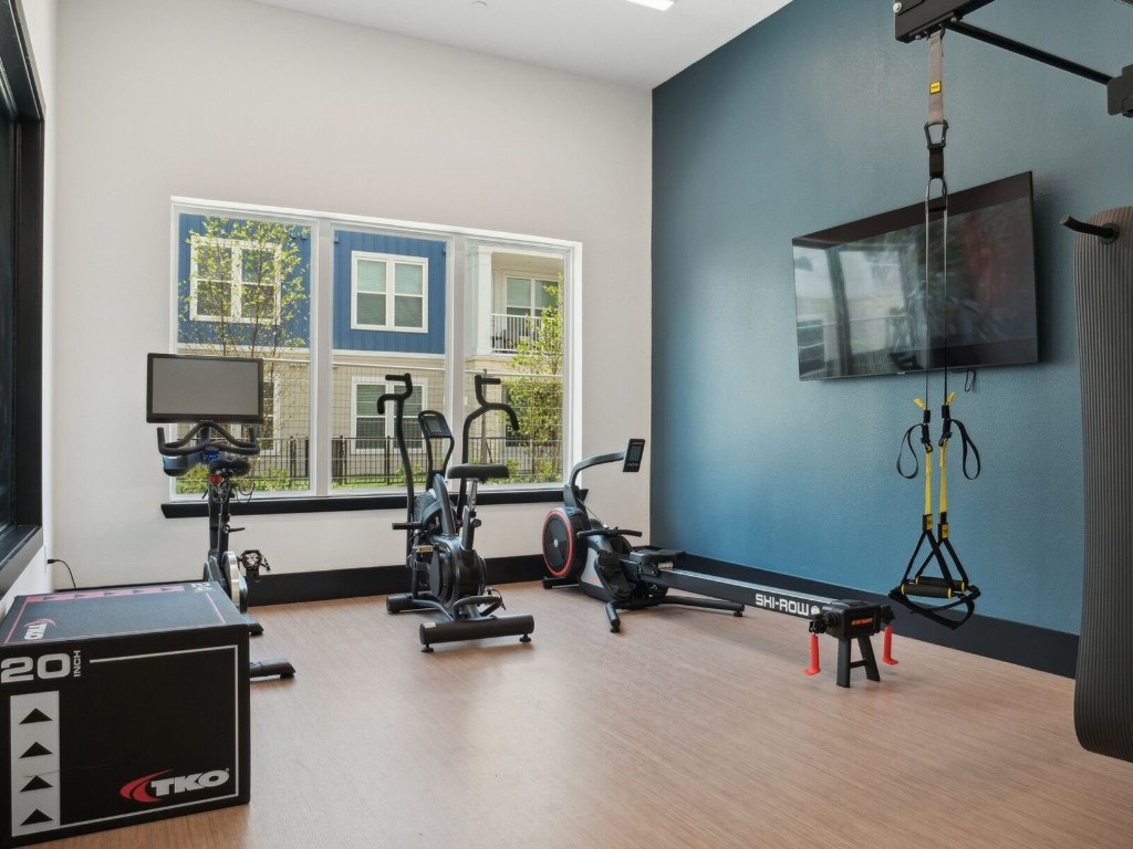 23100 Clay Road, Unit 9203 Katy, TX 77493 - Photo 25 of 29 a view of a workspace with gym equipment