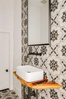 a bathroom with a bathtub and shower