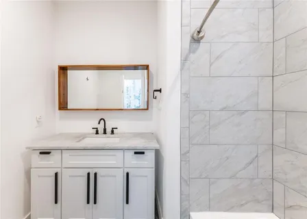 a bathroom with a sink and a mirror