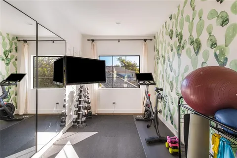 a view of workspace with wooden floor windows wardrobe