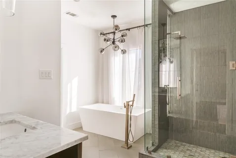 a bathroom with a table and shower