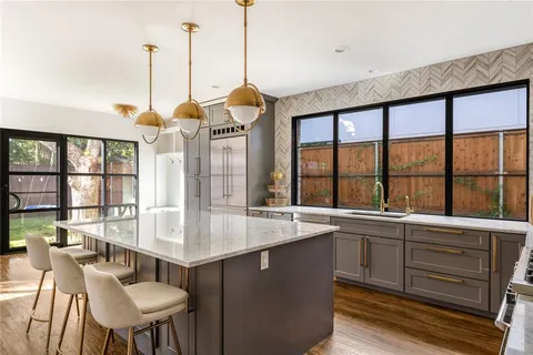 a very nice looking dining room with a large window