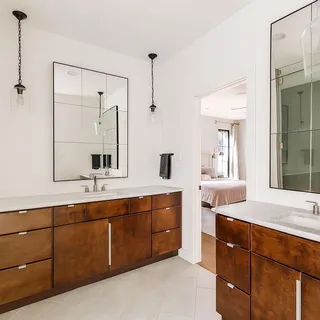 a spacious bathroom with a granite countertop sink mirror and double