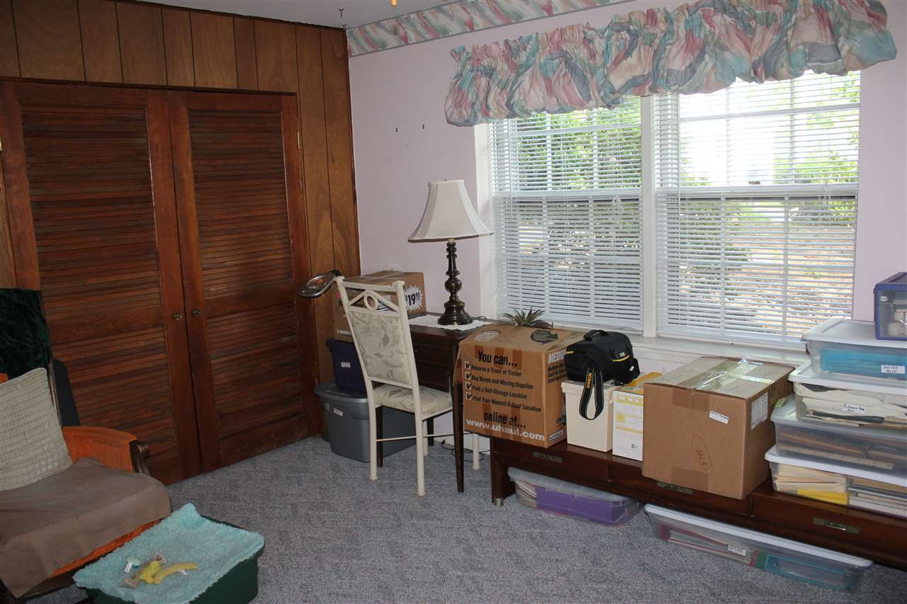 816 Macon Place Raleigh, NC 27609 - Photo 12 of 17 Lower Level Front Bedroom with side access door to outside. Bedroom