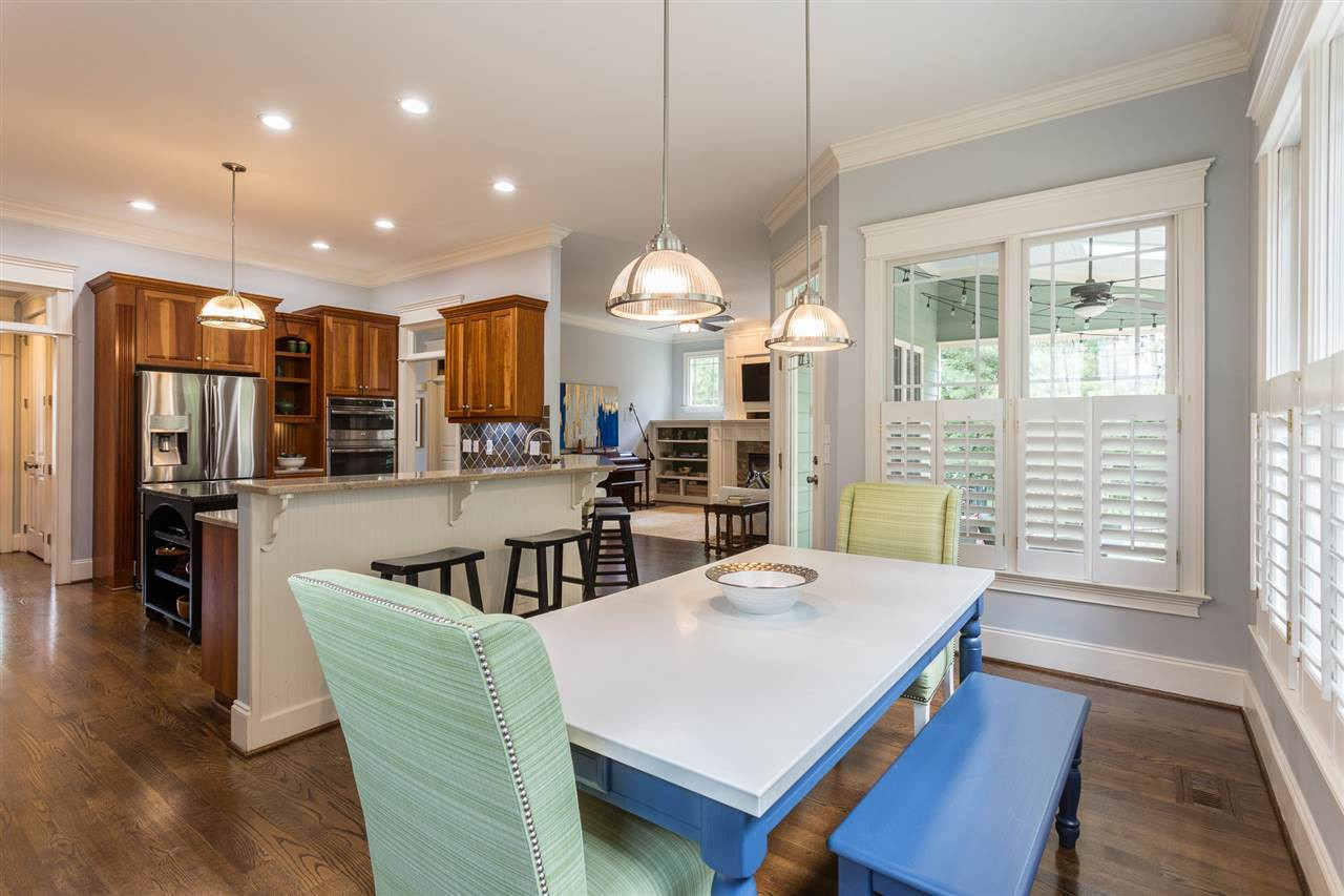 1716 Stannard Trail Raleigh, NC 27612 - Photo 11 of 30 The breakfast room features new twin light fixtures, plantation shutters, and hardwood floors. It is open to the kitchen and family room. Breakfast Room