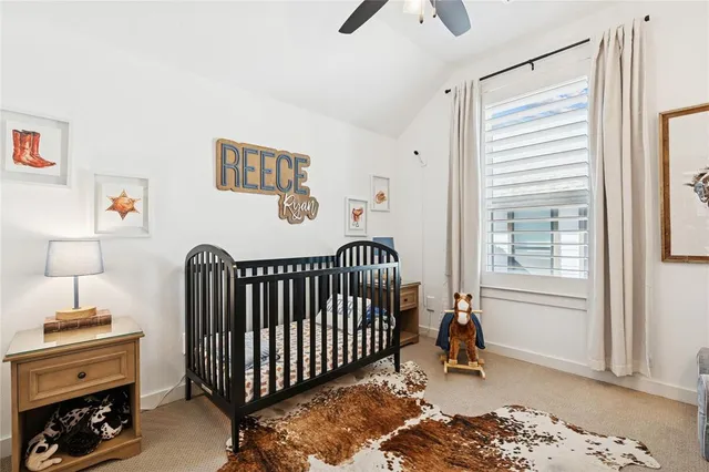 a bathroom with a granite countertop sink vanity mirror and toilet