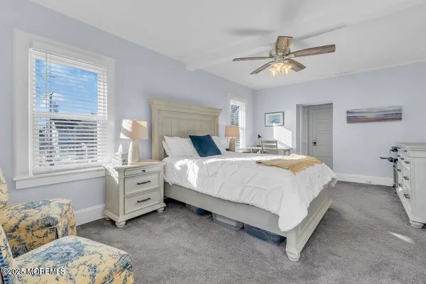 a bedroom with bed and window