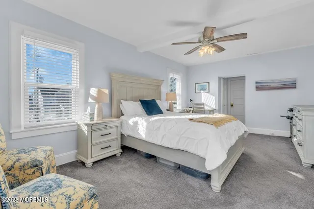 a bedroom with bed and window