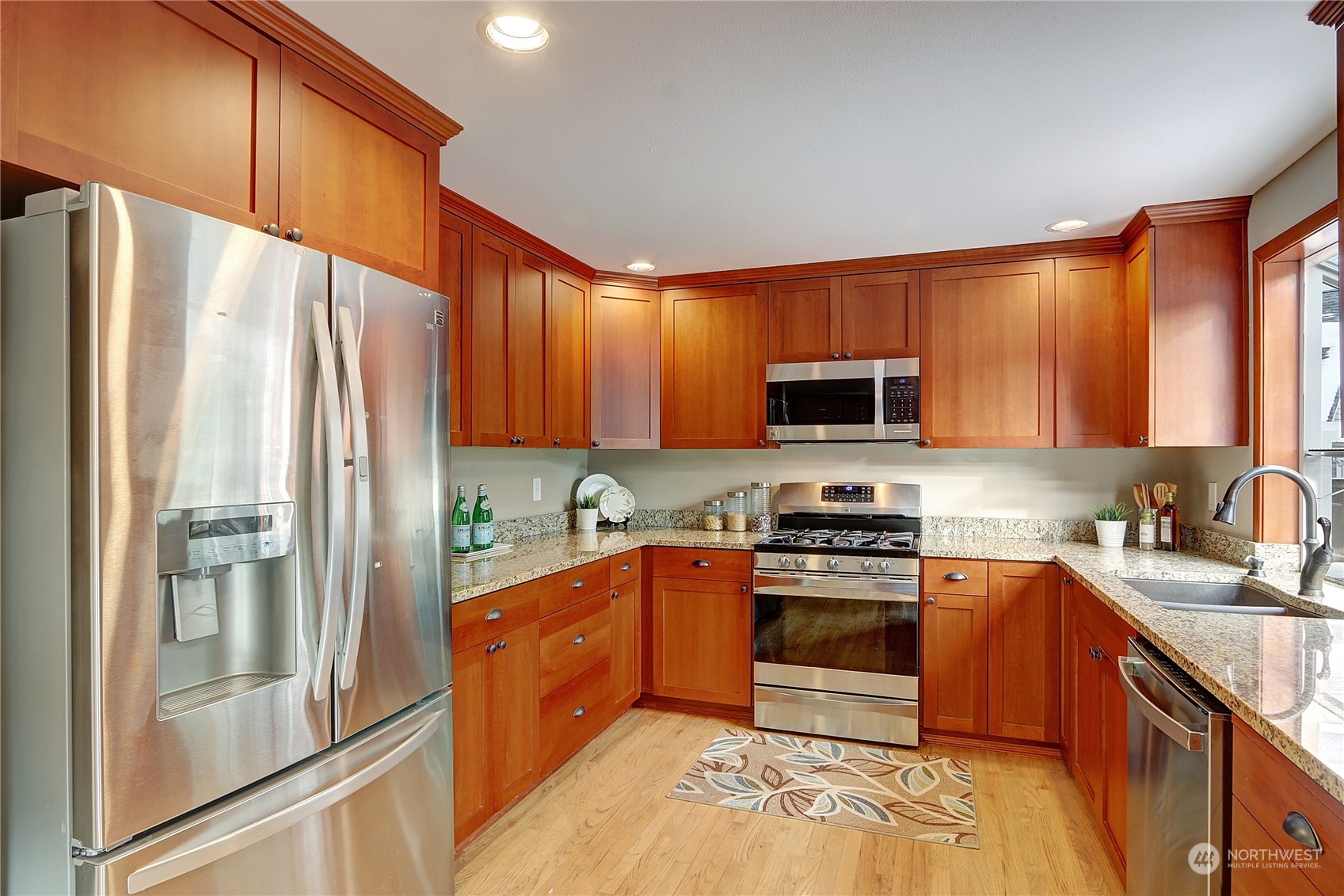 2332 238th Place Southeast Bothell, WA 98021 - Photo 11 of 32 a kitchen with stainless steel appliances granite countertop a refrigerator stove and sink
