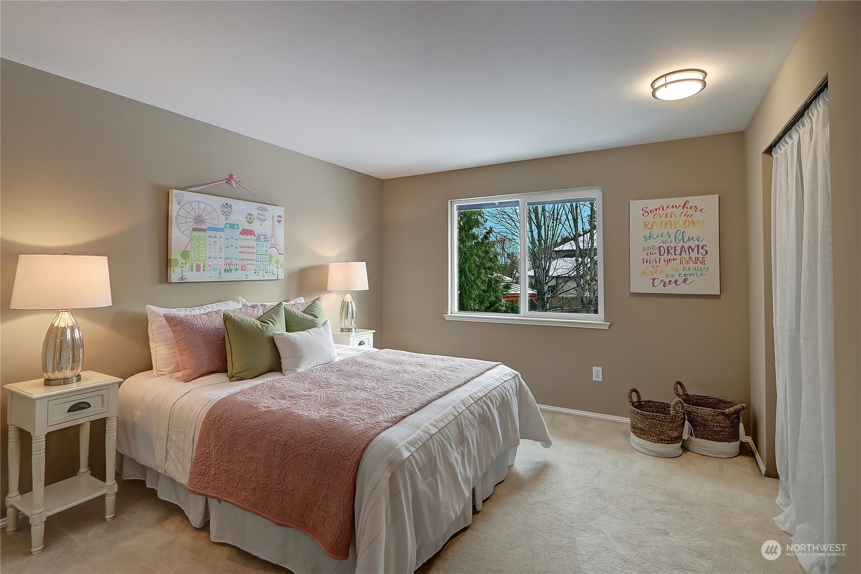 2332 238th Place Southeast Bothell, WA 98021 - Photo 20 of 32 a bedroom with a bed a wall painting and a window