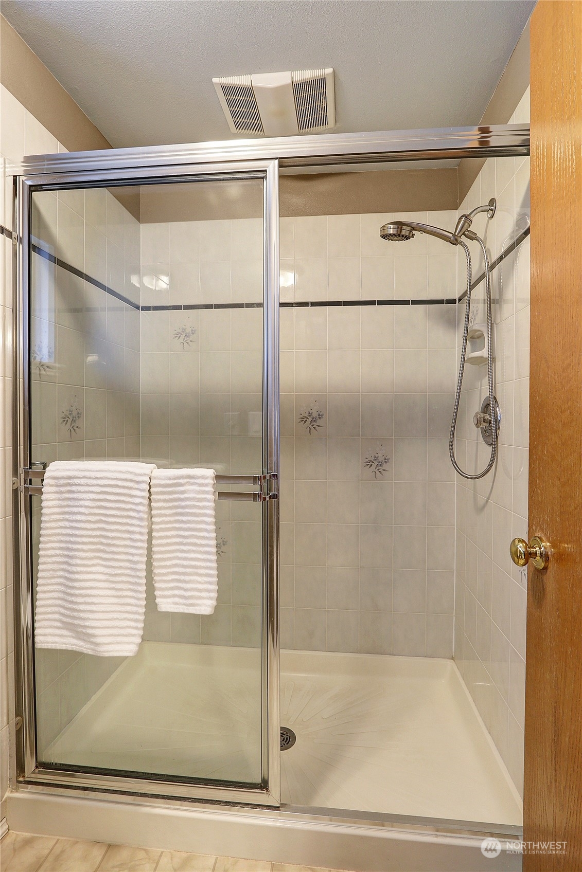 2332 238th Place Southeast Bothell, WA 98021 - Photo 26 of 32 a bathroom with a glass shower door