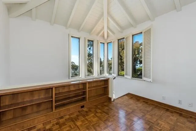 a view of room with window and hardwood floor