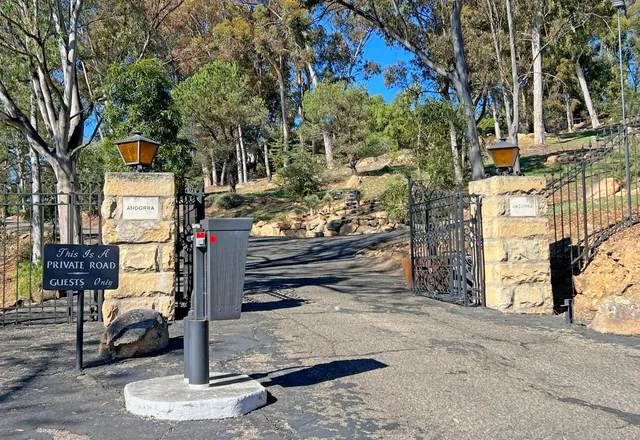 a street sign on a brick wall