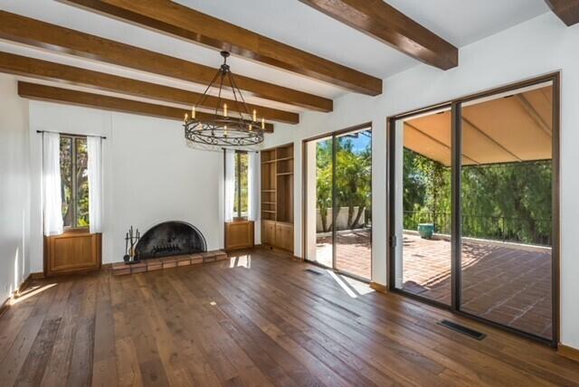 2360 Foothill Road Santa Barbara, CA 93105 - Photo 3 of 24 a view of a livingroom with furniture wooden floor windows and a fireplace