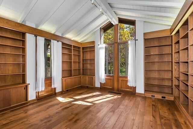 2360 Foothill Road Santa Barbara, CA 93105 - Photo 4 of 24 an empty room with wooden floor and door