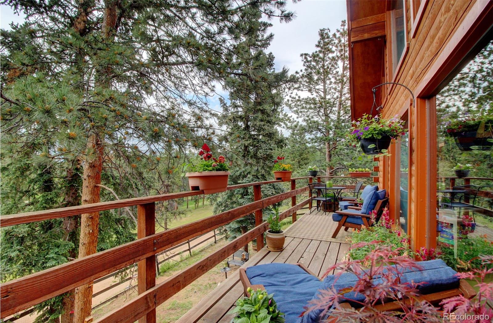 135 Nova Drive Pine, CO 80470 - Photo 25 of 38 a view of a balcony with two chairs
