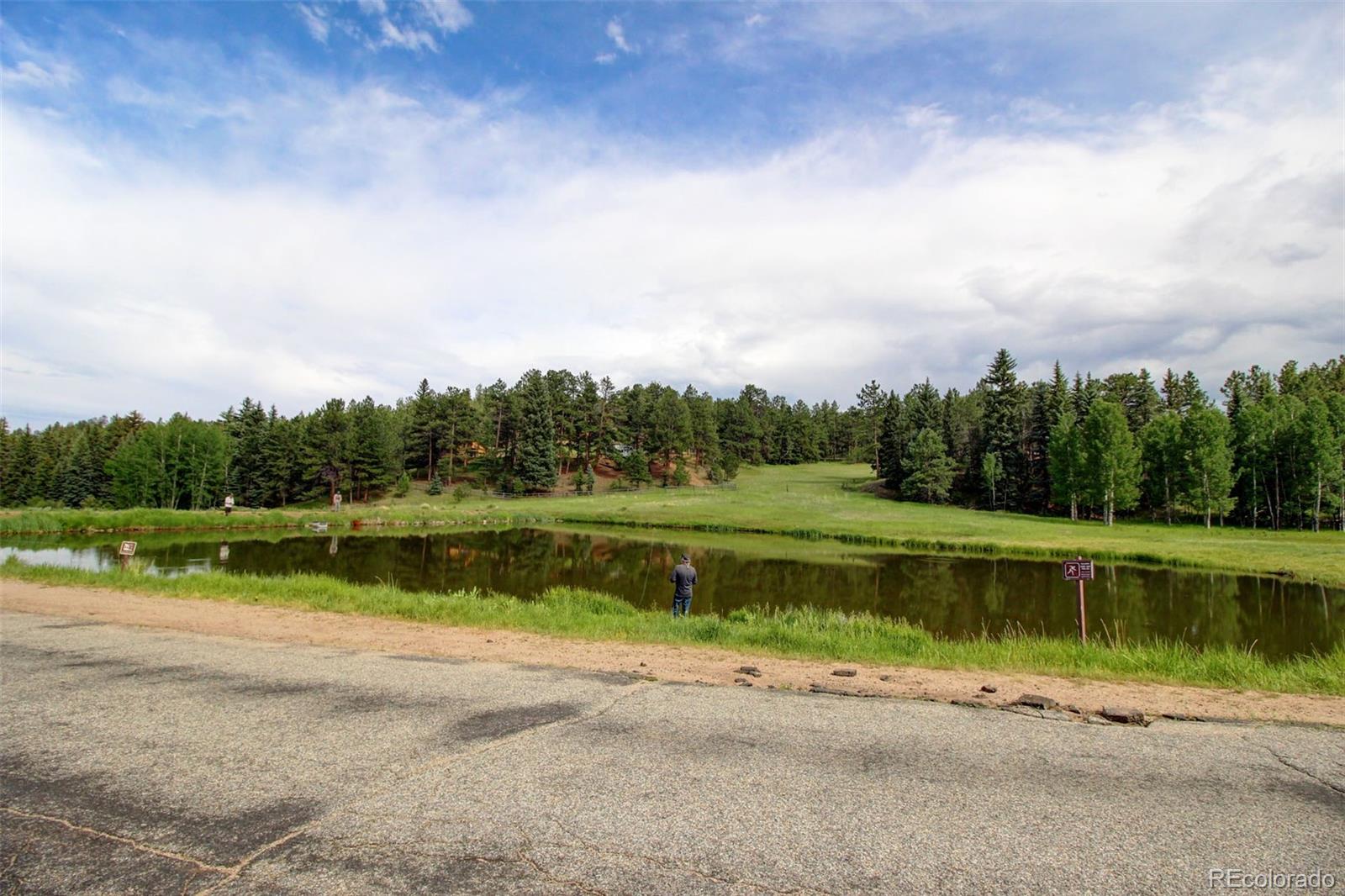 135 Nova Drive Pine, CO 80470 - Photo 38 of 38 a view of a lake with a big yard