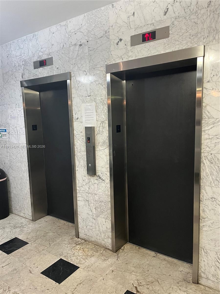 8233 Harding Avenue, Unit 305 Miami Beach, FL 33141 - Photo 12 of 39 a hallway with storage and utility