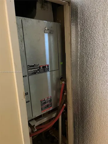 a kitchen with stainless steel appliances granite countertop a refrigerator stove top oven and sink