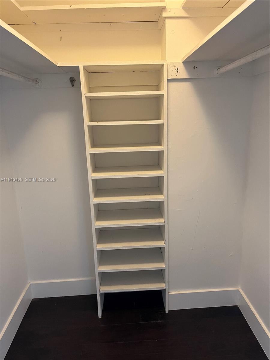 8233 Harding Avenue, Unit 305 Miami Beach, FL 33141 - Photo 27 of 39 a view of walk in closet with empty racks