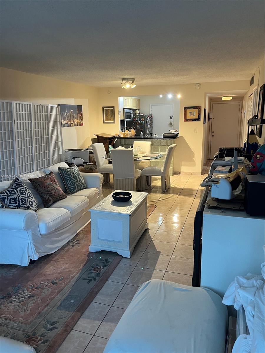 8233 Harding Avenue, Unit 305 Miami Beach, FL 33141 - Photo 32 of 46 a living room with furniture