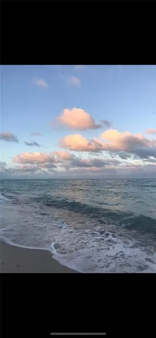 a view of a ocean with a beach
