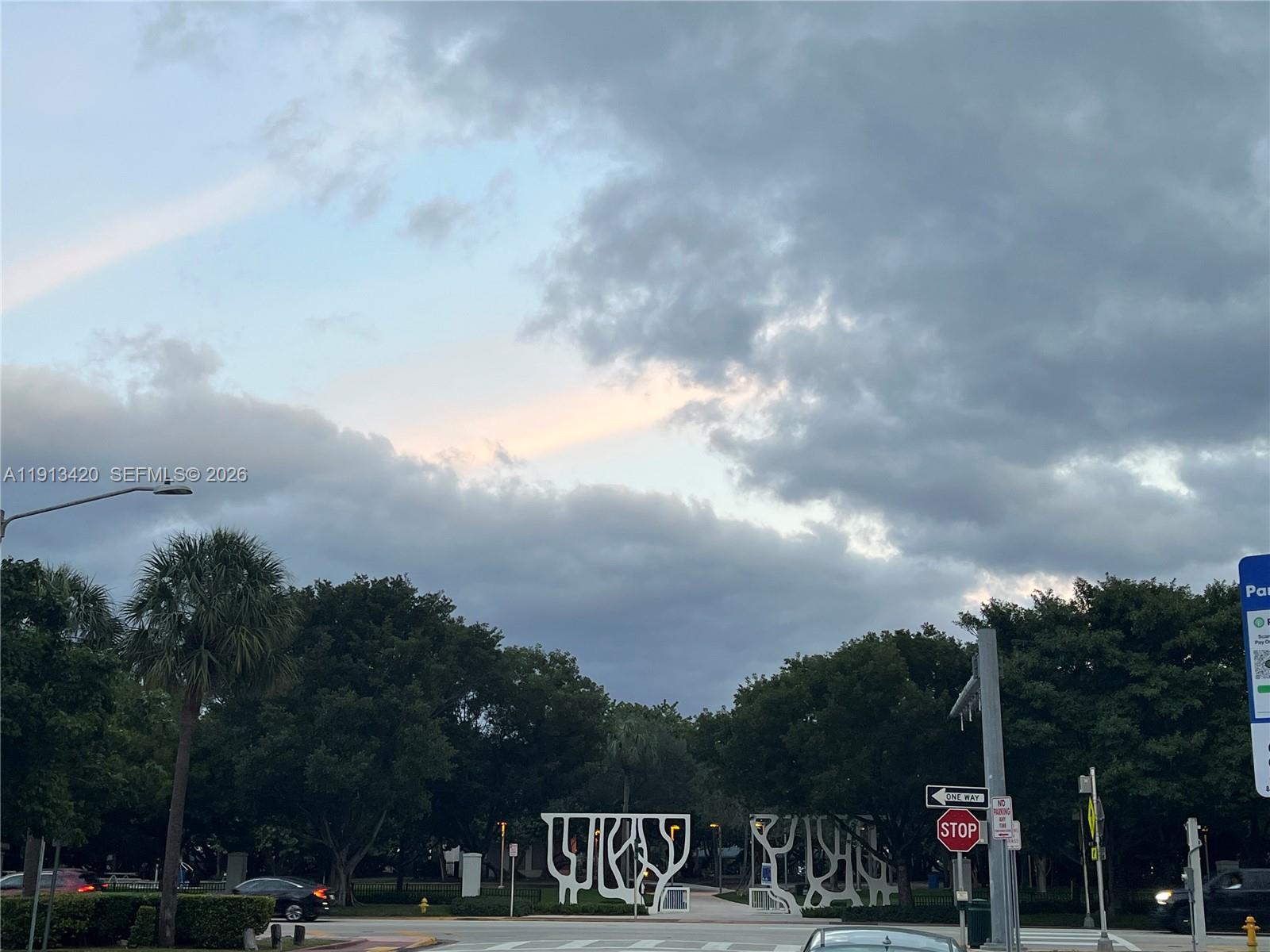 8233 Harding Avenue, Unit 305 Miami Beach, FL 33141 - Photo 8 of 39 a front view of a house with a yard and sitting area