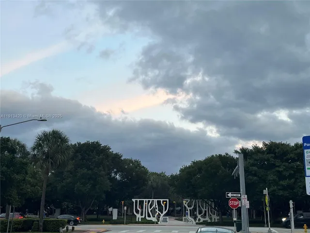 a front view of a house with a yard and sitting area