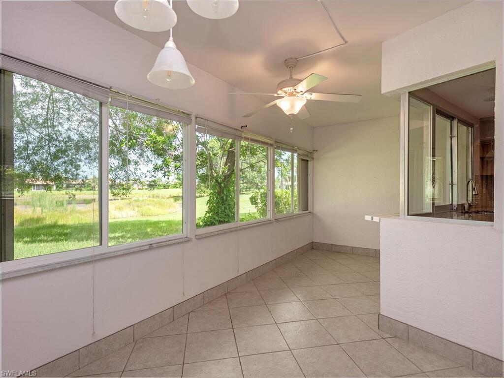 130 Round Key Circle, Unit G10 Naples, FL 34112 - Photo 11 of 12 a view of an empty room with a large window