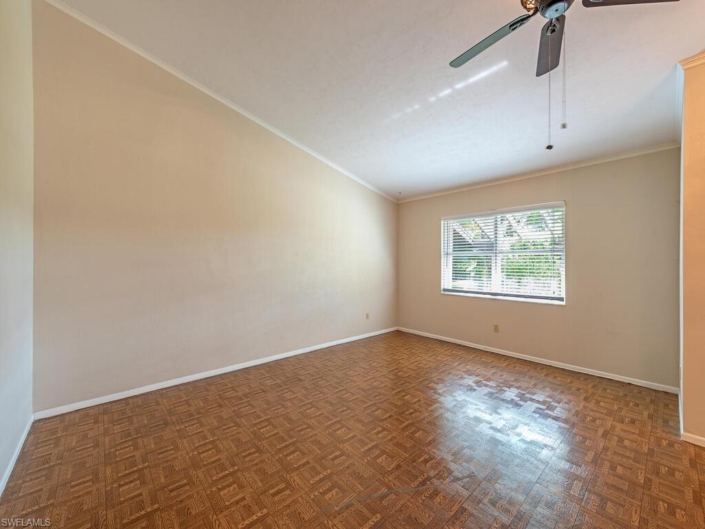 130 Round Key Circle, Unit G10 Naples, FL 34112 - Photo 2 of 12 an empty room with wooden floor and windows