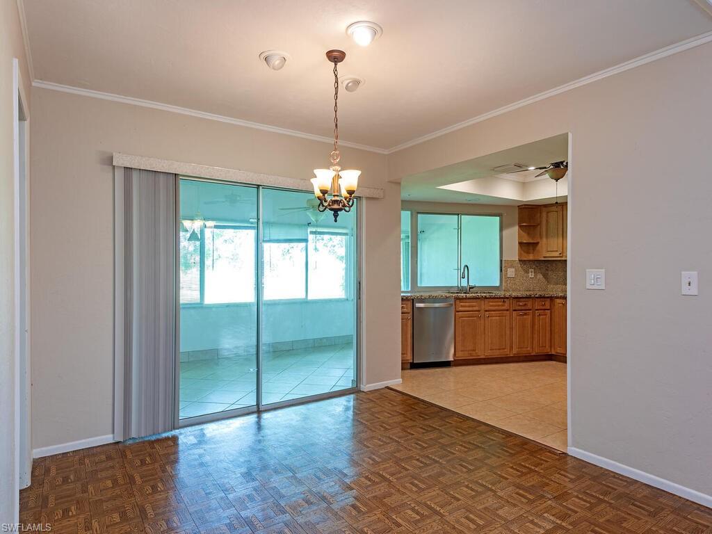 130 Round Key Circle, Unit G10 Naples, FL 34112 - Photo 5 of 12 a view of a kitchen with a sink and a window