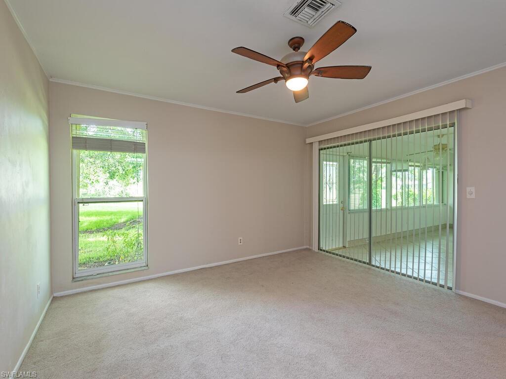 130 Round Key Circle, Unit G10 Naples, FL 34112 - Photo 7 of 12 a view of an empty room with a window