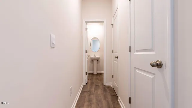 a view of a bathroom from a hallway