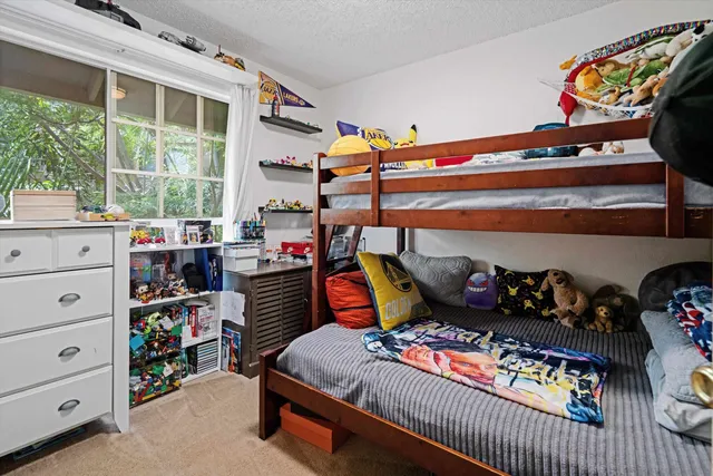 a bed room with a bed and a window